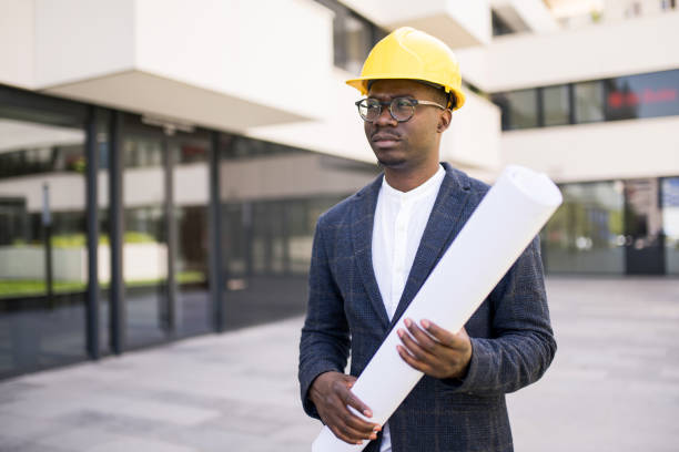 istock Young Architect standing outside of an office building. 1336794155