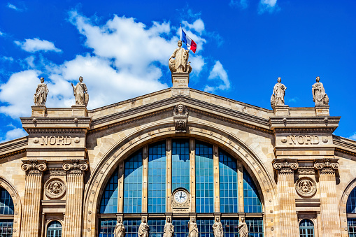 Gare du Nord North Train Station Flag Statues Building Paris France. Built in 1860s, one of six railroad stations in Paris Busiest railway station in Europe