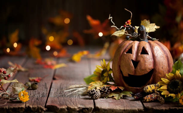 istock Jack O' Lantern against a wood background 1336802684