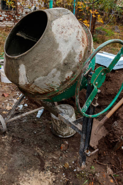 istock Mixing of concrete in the concrete mixer at construction site 1336804872