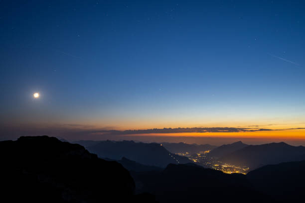 istock Moon and Stars Rising over Mountains 1336809673