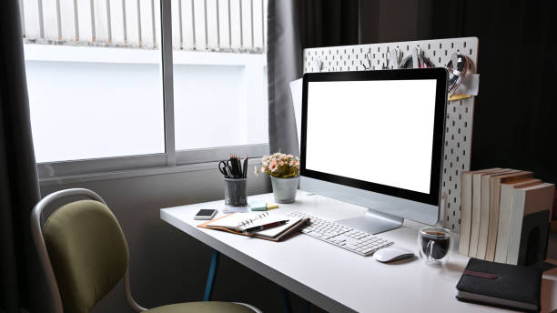istock Home office with mock up computer and supplies on white desk. 1336813616