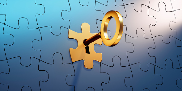 Blue Jigsaw Puzzle with golden Puzzle Piece and Key