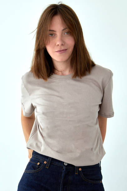 istock Smiling woman in casual outfit standing in studio 1336824694