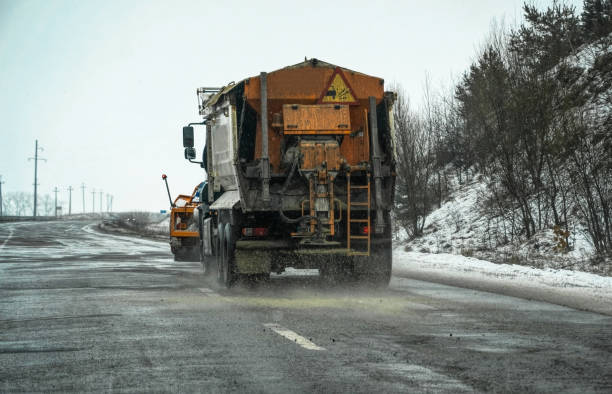 istock Snowblower clears the countryside winter road 1336828533