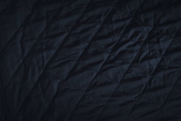 istock Black fabric texture background, abstract luxury cloth. 1336834192