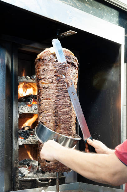 istock Cutting Turkish meat doner kebab 1336834274