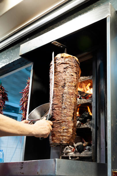 Cutting Turkish meat doner kebab stock photo