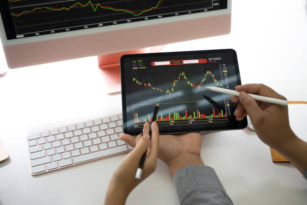 istock Two businesspeople analyzing statistics financial on digital tablet together. 1336834308