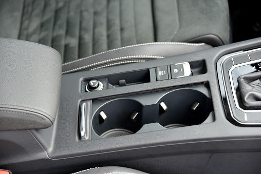 Cup holder on the console in the car. Part of the car's interior