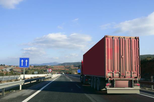 istock Heavy transportation truck lorry on a road 1336837513