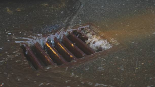 istock Street Water Drain Sewer Overflowing During Heavy Rainfall Storm 1336837807