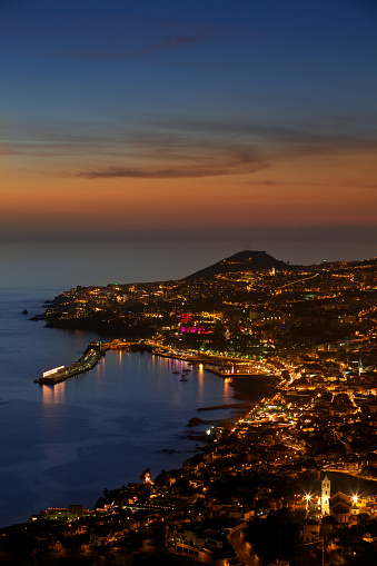 A colourful elevated view over Funchal, the capital city of Madeira, photographed just after sunset