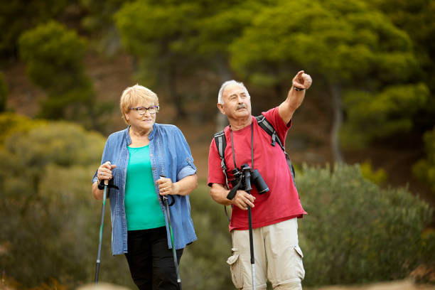 istock Elderly couple hiking together during weekend 1336843147