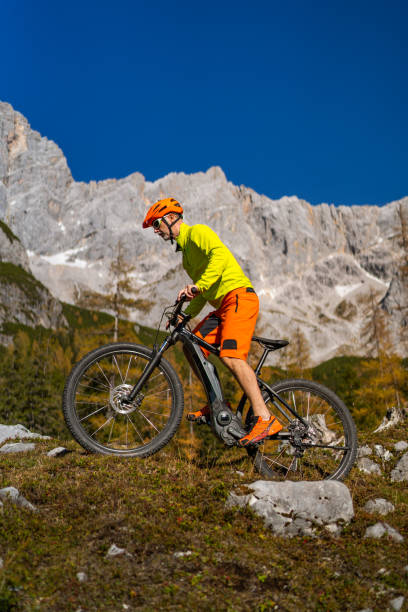 istock One Mature Man on Mountain Bile Trail in Autumn 1336844532