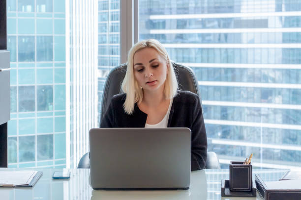 istock Beautiful woman works in office 1336853927