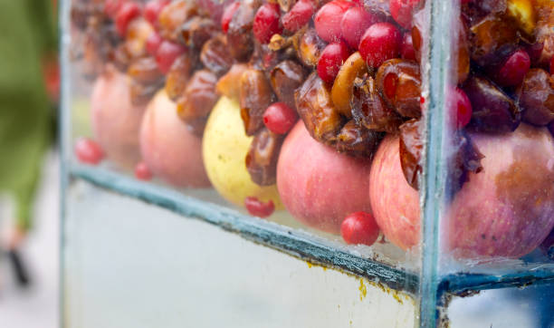 Various kinds of fruits and herbs item inside of a glass rack