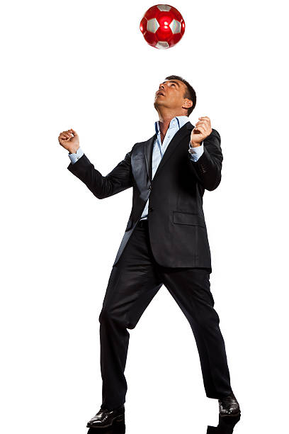 istock one business man playing juggling soccer ball 133686332
