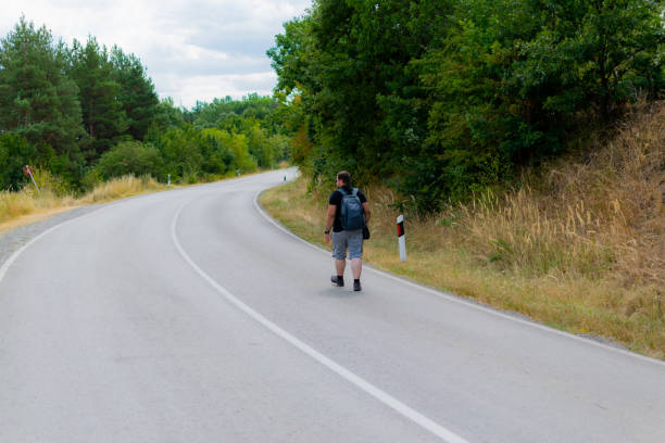 istock Images of a young male photographer using his camera. 1336864113