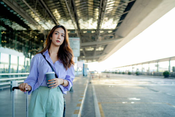 Beautiful woman is calling a bus through an application.