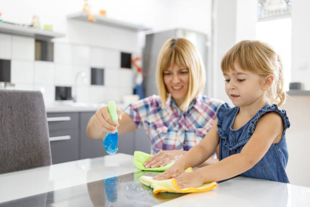 istock Young child helping parent when cleaning a house 1336865799