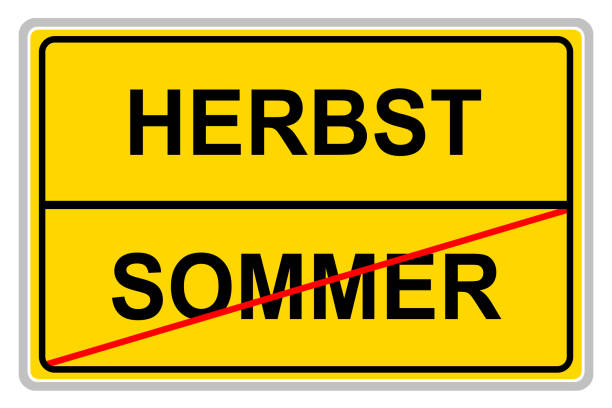 istock German Summer and Autumn on yellow sign isolated against white background 1336868148