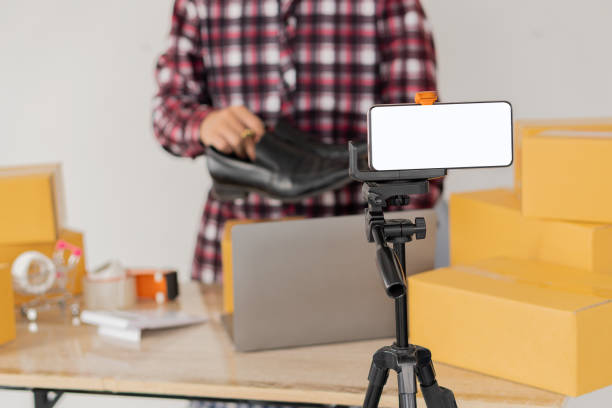 istock Start an Asian writing business working with parcel boxes at home with laptops to read orders and deliver products to customers. transport and logistics Online merchants and business owners or SMEs, online shopping and e-commerce. 1336870889