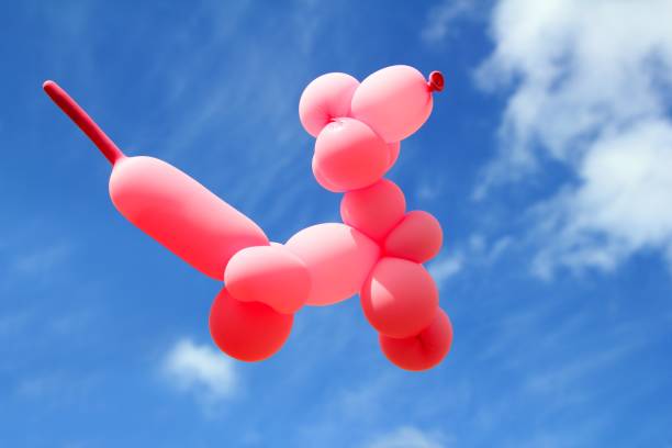 istock balloon with poodle dog caniche shape fly blue sky 1336872131