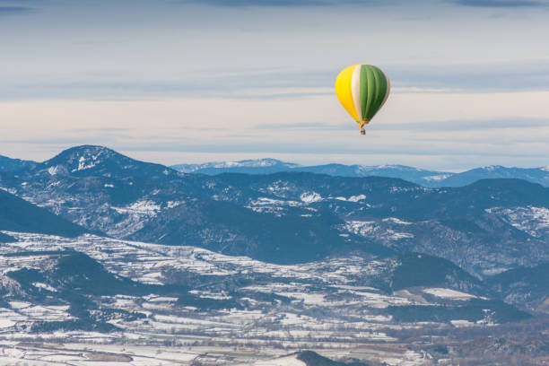 istock Balloon flying over snowy mountains 1336872198