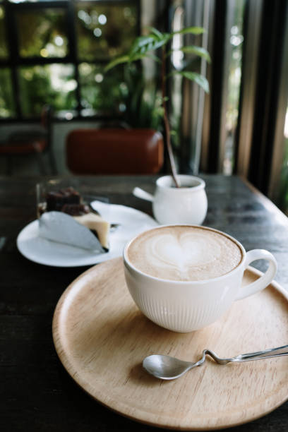 istock Cup of hot coffee on the table in a cafe 1336872535