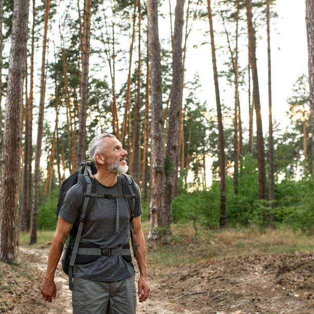 istock Happy mature caucasian man with large backpack 1336876741