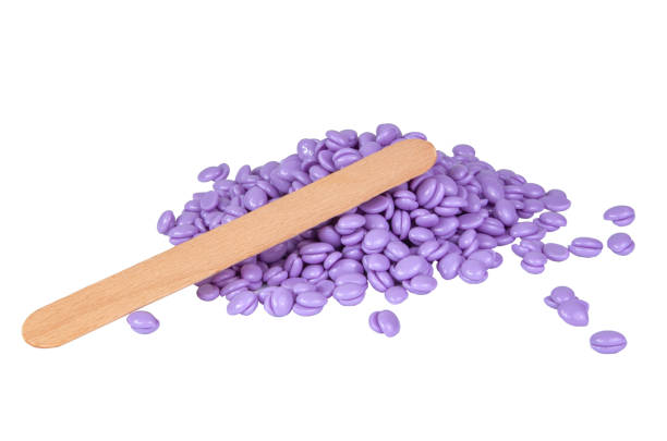 istock Aromatherapy violet lavender wax drops for depilation isolated on the white 1336877885