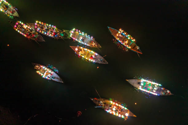 Lantern boats on Thu Bon river Drone night view Thu Bon river of ancient town Hoi An with lantern boats, Quang Nam province, Vietnam. thu bon river stock pictures, royalty-free photos & images