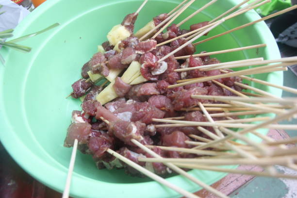 istock raw meat that has been skewered ready to be cooked to serve as satay on a bowl 1336891254