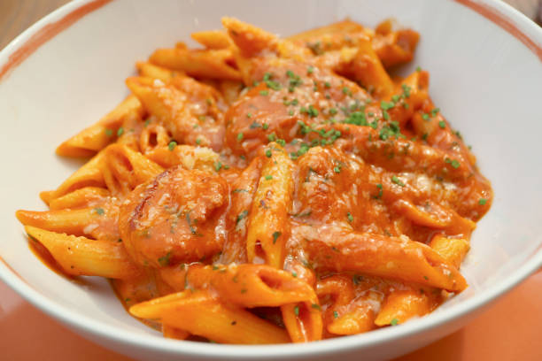 Penne Pasta with Shrimp and Spicy Arrabbiata Sauce in a White Bowl