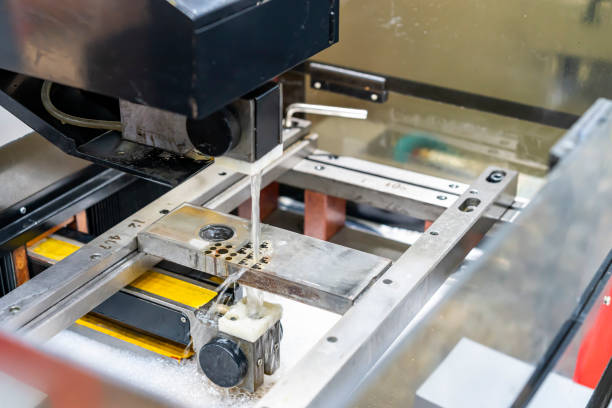 istock close up metal workpiece during cutting by automatic and accurate electric wire cut edm machine 1336898959