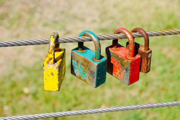istock Colorful rusty old love padlocks on a wire 1336901633