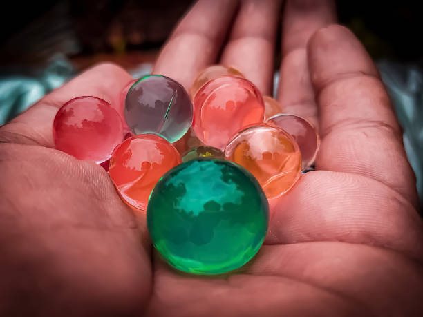 istock Colorful bubbles on human palm closeup view 1336902135