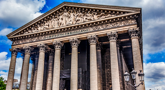 Outside Facade La Madeleine Church Paris France. Catholic church created in 1800s as Temple to glory of Napoleon's army, later renamed for Mary Magdalene