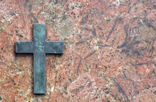 cross on gravestone.