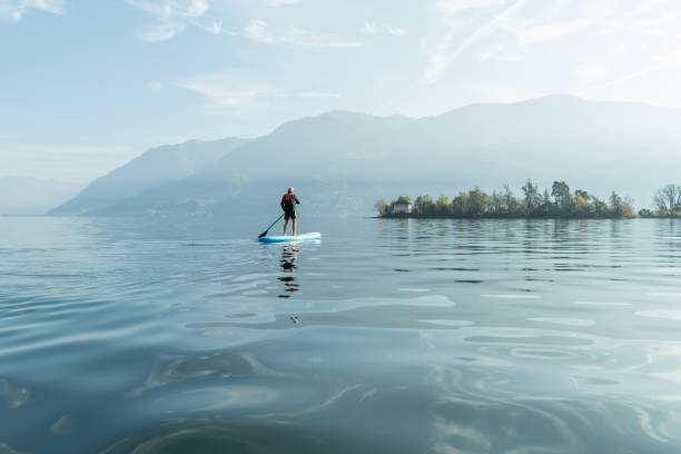 istock Man paddling on a stand up paddle board 1336904184