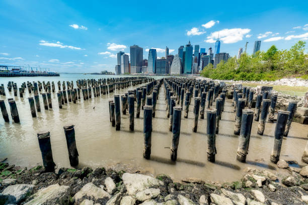 istock Skyline of Pillars and New York with water reflection 1336904612