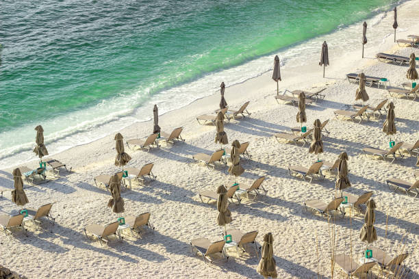 istock white sand beach with emerald sea water early morning 1336907584