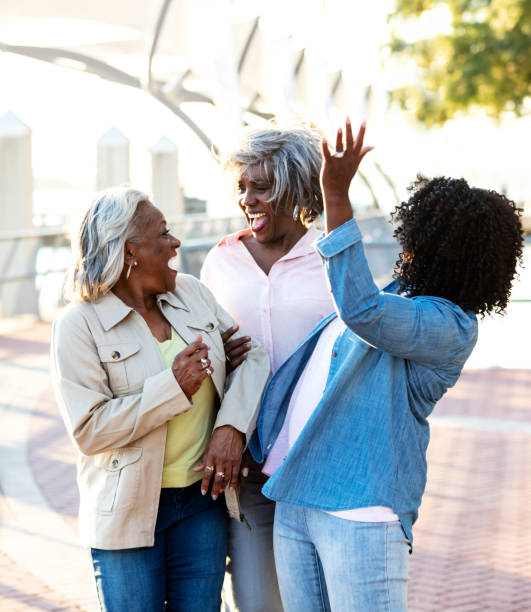 istock Three senior African-American women, friends conversing 1336910110