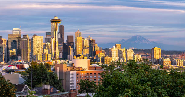 istock Sunset Orange Light on Downtown Seattle Buildings with Mount Rainer in the Background 1336911272