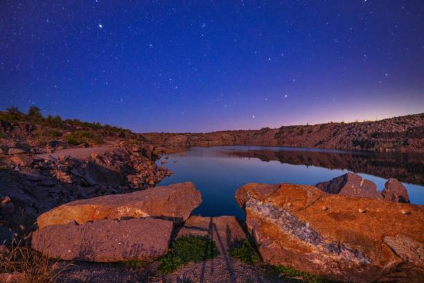 istock Small lake surrounded by stone waste from mine work 1336914417