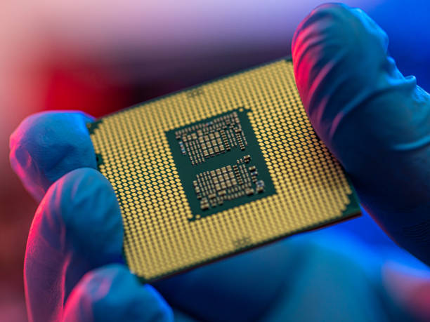 istock manipulating and installing processor on the motherboard in details with blur and selective focus 1336917744
