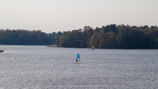 Sailing crew on sailboat turning on buoy on regatta. Models and event regatta property released.