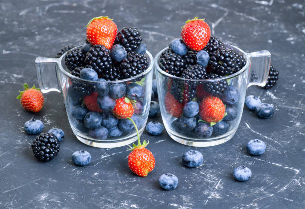 istock Two gasses of various fresh berries on black 1336925818