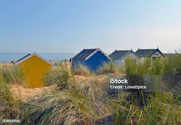 Colorful Wooden Beach Huts On A Beach On The East Coast Of England No Recognizable People Stock Photo - Download Image Now